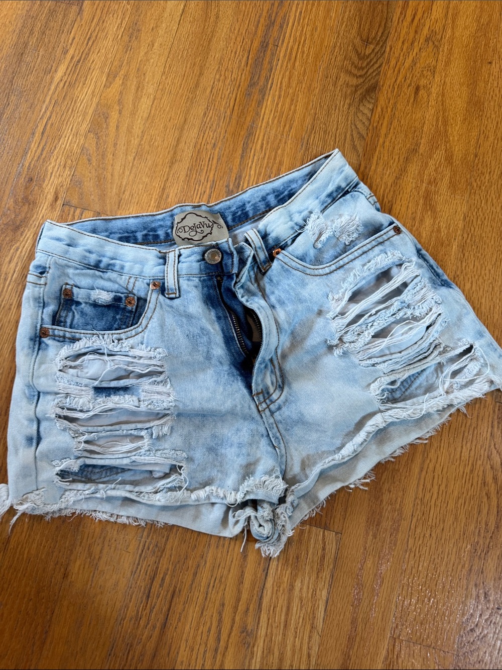ODolly High-Rise Light Wash Distressed Denim Shorts